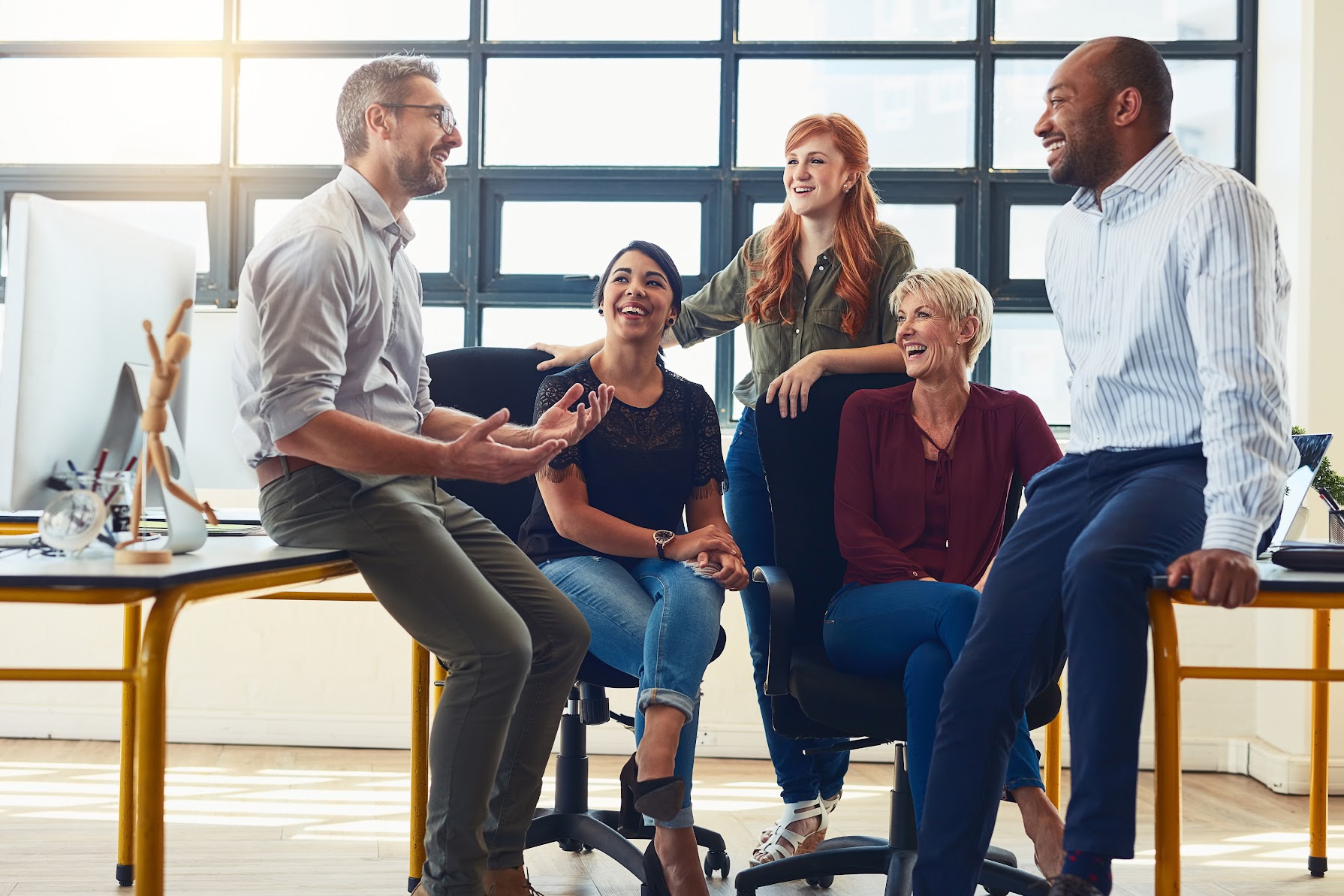 Shot of a group of designers having a discussion in an office